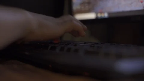 Hand of man typing on keyboard at midnight doing work. Selective focus. Stock Footage 93109367