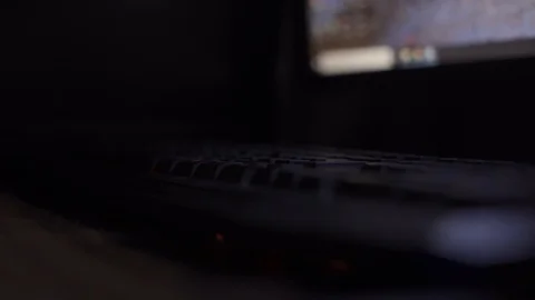 Hand of man typing on keyboard at midnight doing work. Selective focus. Stock Footage 93110591