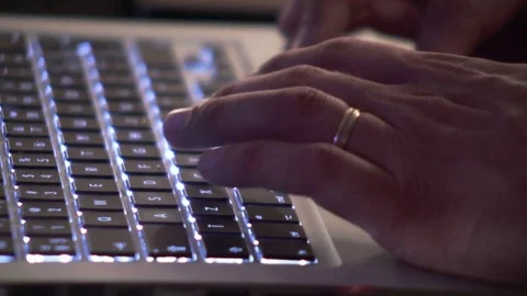 Hand of a man typing on a laptop Stock Footage 83053465