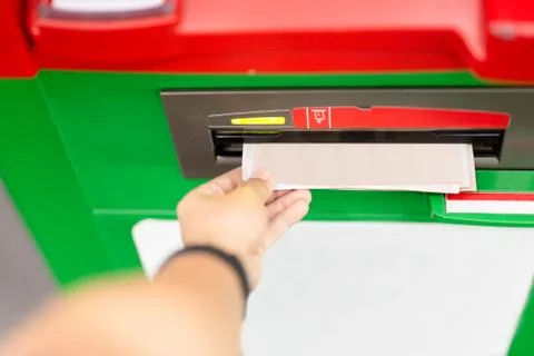 Hand of man using an ATM machine with credit card. Stock Photos