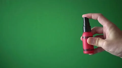 Hand of Man Using Disinfectant Spray Against Covid-19 Virus Isolated Background Stock Footage 135662479