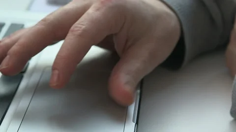 Hand of man using laptop touchpad, London, England, UK Stock Footage 155053943