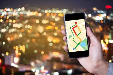 Hand of man using map on smartphone application with bokeh background of city Stock Photos