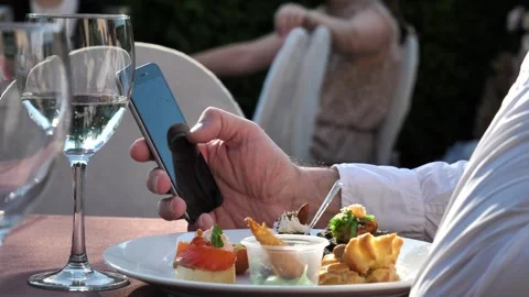 Hand of a man using a mobile phone, reading a phone message and viewing news on Stock Footage 278581470