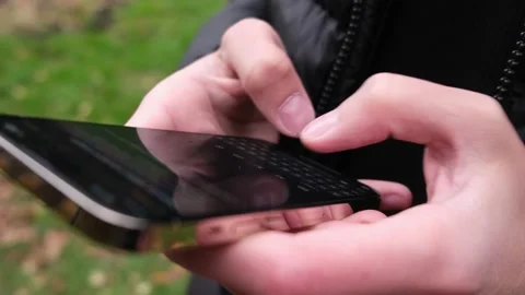 Hand of man using of new iphone 14 Pro , typing message. 動画素材 218566918