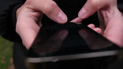 Hand of man using of new iphone 14 Pro , typing message. Stock Footage 218566925