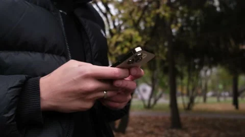 Hand of man using of new iphone 14 Pro , typing message. Stock Footage 218566992