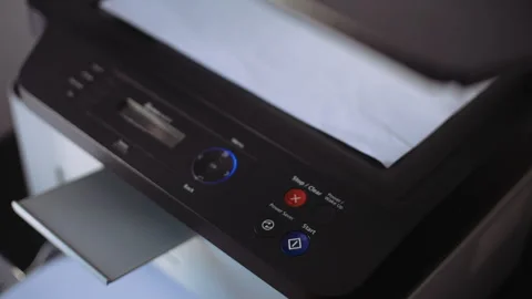 Hand of man is using a photocopier to copy documents. Video stock 262349345