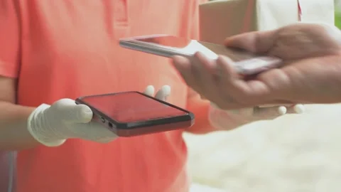 Hand of a man using QR code scanner with smartphone for a parcel payment. Video stock 154672032