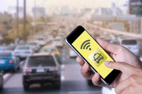 Hand of man using smartphone call taxi by application smartphone and wifi net Stock Photos