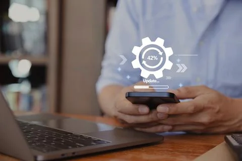 Hand of man using smartphone for update software application. Foto stock