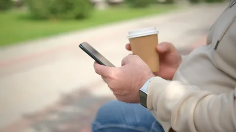 Hand of man using texting mobile phone or chat. Close up of man hand 4K Stock Footage 252108692