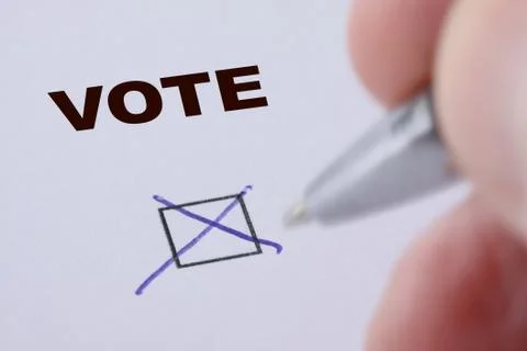 Hand of man voting - sets mark in check box with pen Stock Photos
