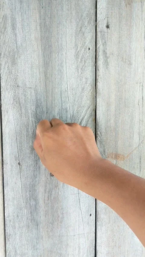 The hand of a man who is knocking on the door Stock Footage 288837202