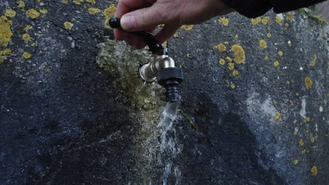 Hand of a man who opens the tap of a fountain Stock Footage 149117271