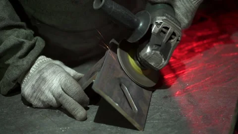 Hand man work wearing gloves while Grinding metal Stock Footage 157114958