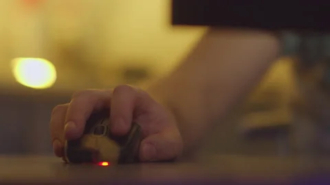 Hand of a man working on a computer presses the buttons of a computer mouse Stock Footage 154331361