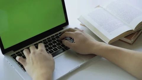 Hand of man working on laptop in office with chroma key green screen Stock Footage 80526596