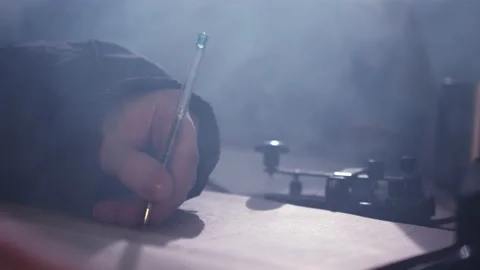 Hand of man writing down information received from telegraph Stock Footage 230691767