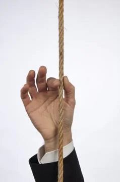 Hand of managers plucking a string Stock Photos