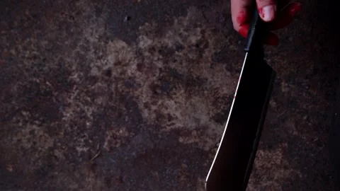Hand of maniac or killer hold knife in blood closeup Stock Footage 249322028