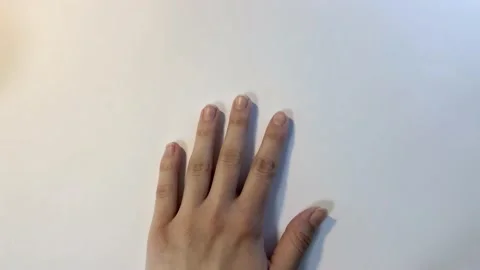 Hand manicure with nail file. close up over white background. Spa at home. Stock Footage 132393318