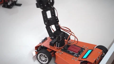 Hand manipulator. Robot car at an robotics lesson. Children's toy. Educational Stock Footage 258912460