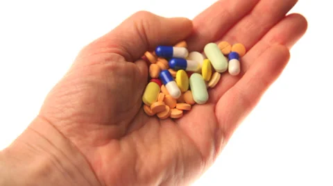 Hand with many pills and capsules Stock Footage 32243517