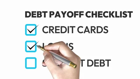 Hand marking debt payoff checklist on white background Stock Footage 334572411