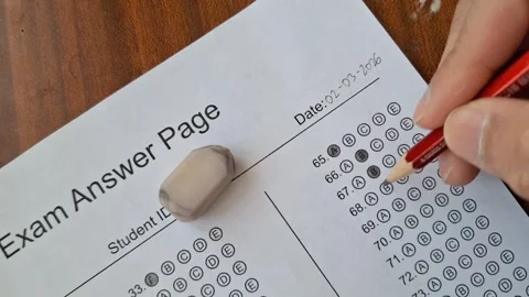 Hand marks answer on test sheet with pencil Stock Footage 330760045