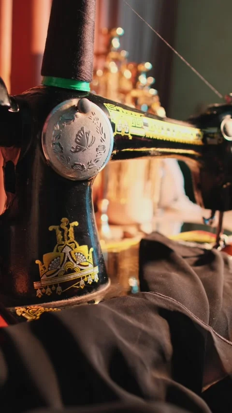 Hand of master atelier working on sewing machine in workshop Stock Footage 273469719