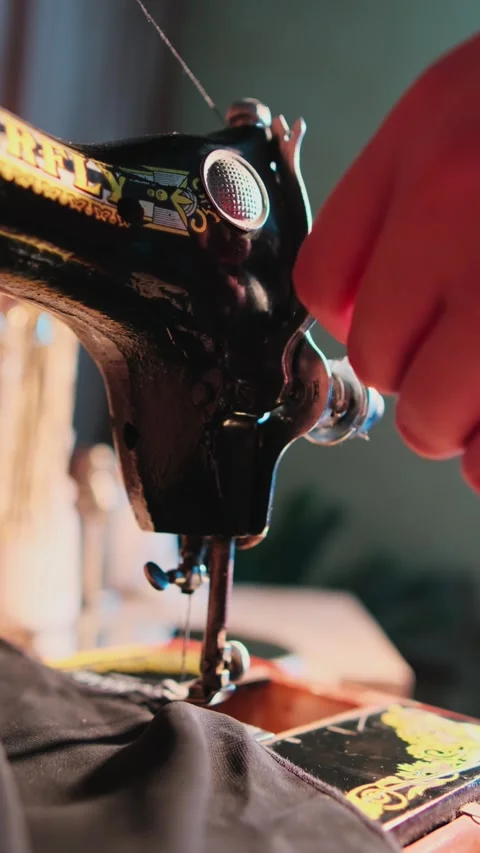 Hand of master atelier working on sewing machine in workshop Stock Footage 311681726