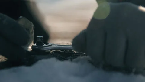 The hand of the master twists the nut close-up. Stock Footage 87924387