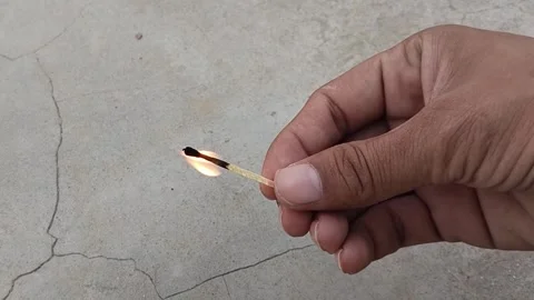 Hand matches burn Stock Footage 252866390