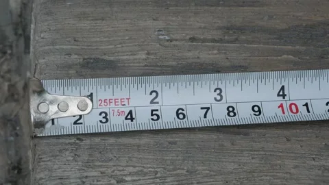 Hand Measuring Concrete Edge with Tape Measure Stock Footage 340425325