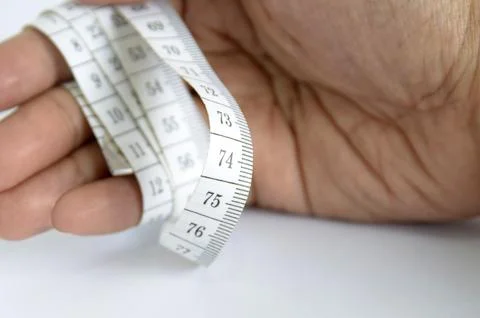 Hand with measuring tape Stock Photos