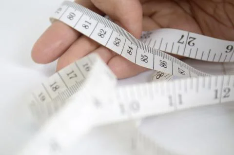 Hand with measuring tape Stock Photos