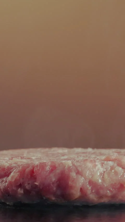 Hand, meat and chef with burger for restaurant, cooking and fast food for lunch Stock Footage 340457902