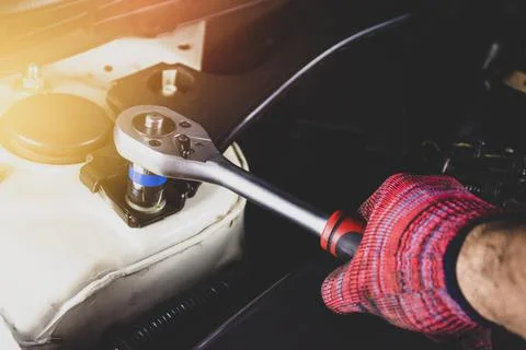 Hand of mechanic man has using socket wrench Stock Photos