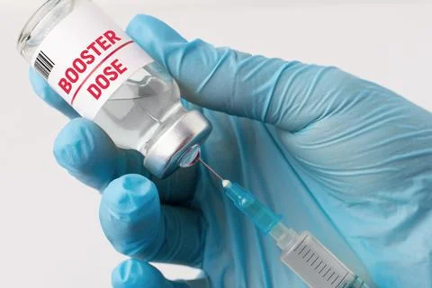 Hand of medical worker preparing for taking a booster shot of vaccine Stock Photos