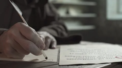 Hand of a medieval monk copying text from a liturgy page Video stock 337649179