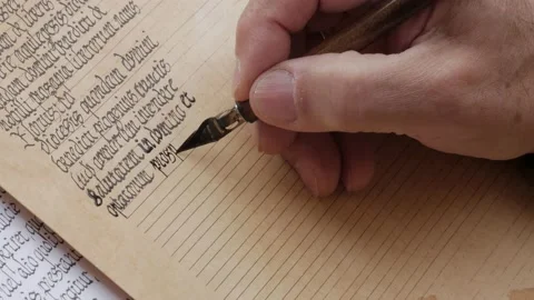 Hand with medieval pen transcribes a latin manuscript Stock Footage 195093298