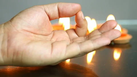 Hand of  meditating man with fire flame of lantern background , in studio Chiang 스톡 동영상 159471091