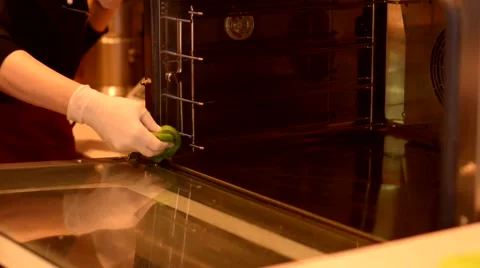 Hand with microfiber cleaning electric oven Vídeos de archivo 59579859