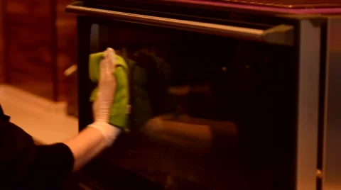 Hand with microfiber cleaning outside electric oven Vídeos de archivo 59579198