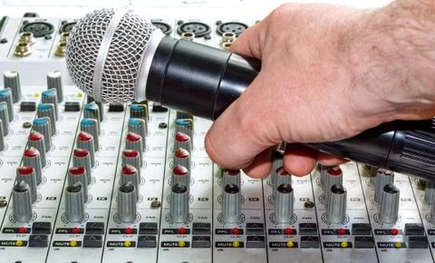 Hand with microphone Stock Photos