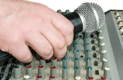 Hand with microphone Stock Photos