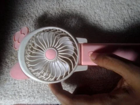Hand with Mini Fan Stock Photos