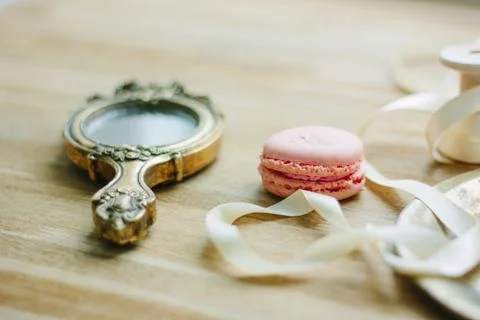 Hand mirror and macaroon as wedding decoration Stock Photos
