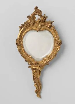 Hand mirror with handle, irregularly round of shape, with carving in C and... Photos